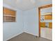 Bedroom with view of kitchen and light blue walls at 7195 Bethesda Ct, Weeki Wachee, FL 34607
