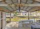Covered waterfront dock with picnic table and storage at 7195 Bethesda Ct, Weeki Wachee, FL 34607