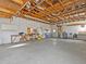 Spacious garage with high ceilings and plenty of workshop space at 7195 Bethesda Ct, Weeki Wachee, FL 34607