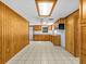 Kitchen with wood cabinets, tile flooring and microwave at 7195 Bethesda Ct, Weeki Wachee, FL 34607