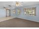 Bright living room with light blue walls, ceiling fan and canal views at 7195 Bethesda Ct, Weeki Wachee, FL 34607