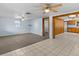 Spacious living room with tile and carpet flooring, ceiling fan at 7195 Bethesda Ct, Weeki Wachee, FL 34607