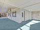 Covered porch with teal carpeting and access to backyard at 7195 Bethesda Ct, Weeki Wachee, FL 34607