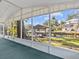 Screened-in porch with water view and lush landscaping at 7195 Bethesda Ct, Weeki Wachee, FL 34607