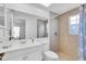 Bathroom with white vanity, toilet and shower/tub combo at 7218 Box Elder Dr, Port Richey, FL 34668