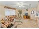 Spacious living room with ceiling fan and comfortable seating at 7745 Waterford St, New Port Richey, FL 34653