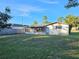 Ranch home with a large backyard and screened porch at 8030 Gulf Way, Hudson, FL 34667