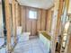 Unfinished bathroom featuring a toilet and bathtub at 8030 Gulf Way, Hudson, FL 34667