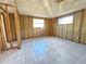 Unfinished bedroom with tile flooring and exposed walls at 8030 Gulf Way, Hudson, FL 34667
