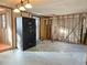 Garage area during remodel with a large safe and exposed framing at 8030 Gulf Way, Hudson, FL 34667