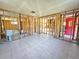 Home's interior under renovation, showing framework and flooring at 8030 Gulf Way, Hudson, FL 34667