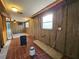 Kitchen area during remodel, showing tiled floors and exposed utilities at 8030 Gulf Way, Hudson, FL 34667