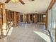Spacious living room with exposed framing and tiled floors at 8030 Gulf Way, Hudson, FL 34667
