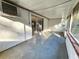 Screened porch with concrete floor and sliding glass doors at 8030 Gulf Way, Hudson, FL 34667