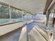 Spacious screened porch with concrete flooring at 8030 Gulf Way, Hudson, FL 34667