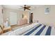 Spacious bedroom with hardwood floors and ceiling fan at 8097 Scenic Pine Ct, Spring Hill, FL 34606