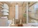 Clean bathroom with shower, toilet and storage at 8700 Cessna Dr, New Port Richey, FL 34654