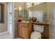 Well-appointed bathroom with tiled floors and a corner vanity at 8700 Cessna Dr, New Port Richey, FL 34654