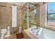 Clean bathroom with walk-in shower, soaking tub, and updated fixtures at 8700 Cessna Dr, New Port Richey, FL 34654