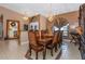 Elegant dining room with a large table and richly colored chairs at 8700 Cessna Dr, New Port Richey, FL 34654