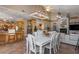 Open dining area with white table and chairs near the kitchen at 8700 Cessna Dr, New Port Richey, FL 34654