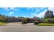 House exterior with a large garage and landscaping at 8700 Cessna Dr, New Port Richey, FL 34654