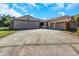 View of the large plane hangar and attached garage at 8700 Cessna Dr, New Port Richey, FL 34654