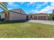 Large garage with a plane hangar door and additional garage space at 8700 Cessna Dr, New Port Richey, FL 34654
