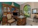 Home office with built-in bookcases and a large desk at 8700 Cessna Dr, New Port Richey, FL 34654