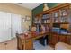 Spacious home office with large desk and built-in shelving at 8700 Cessna Dr, New Port Richey, FL 34654