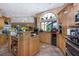Spacious kitchen with island, ample cabinetry, and stainless steel appliances at 8700 Cessna Dr, New Port Richey, FL 34654