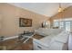 Relaxing living room with white sectional sofa and large TV at 8700 Cessna Dr, New Port Richey, FL 34654