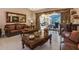 Spacious living room with leather furniture and elegant coffee tables at 8700 Cessna Dr, New Port Richey, FL 34654