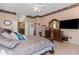 Spacious main bedroom with king-size bed and ample dresser space at 8700 Cessna Dr, New Port Richey, FL 34654