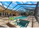 Large screened pool and spa with patio at 8700 Cessna Dr, New Port Richey, FL 34654