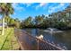 Private waterfront lot with a tranquil pond and fountain at 8700 Cessna Dr, New Port Richey, FL 34654