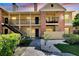 Brick condo building with balconies and stairs at 8718 Mallard Reserve Dr # 202, Tampa, FL 33614