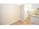 Small kitchen with white cabinets and granite at 8718 Mallard Reserve Dr # 202, Tampa, FL 33614