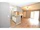 Open kitchen with breakfast bar and living room view at 8718 Mallard Reserve Dr # 202, Tampa, FL 33614