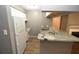 Modern kitchen with granite countertops and white cabinets at 8718 Mallard Reserve Dr # 202, Tampa, FL 33614