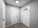 Bright entryway with updated flooring and two doors at 9139 Fairweather Dr, Largo, FL 33773