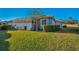 Backyard with green grass and view of the house at 10645 Ruffino Ct, Trinity, FL 34655