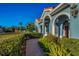 Elegant home entrance with arched walkways and brick pavers at 10645 Ruffino Ct, Trinity, FL 34655