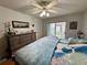 Bright bedroom with king-size bed and sliding doors to patio at 12042 Hoosier Ct # 104, Hudson, FL 34667