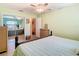 King size bed and ceiling fan in this bright bedroom at 12136 Shadow Ridge Blvd, Hudson, FL 34669