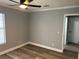 Bedroom with wood-look floors and window at 1221 E Curtis St, Tampa, FL 33603