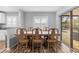 Dining area with wooden table and chairs, pool view at 12212 Mirage Ave, Weeki Wachee, FL 34614