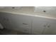 Double vanity bathroom with white sinks at 12719 Lockey Ln, Tampa, FL 33612