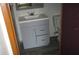 Bathroom with gray vanity and a single sink at 12719 Lockey Ln, Tampa, FL 33612
