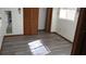 Bedroom with wood-look floors and closet at 12719 Lockey Ln, Tampa, FL 33612